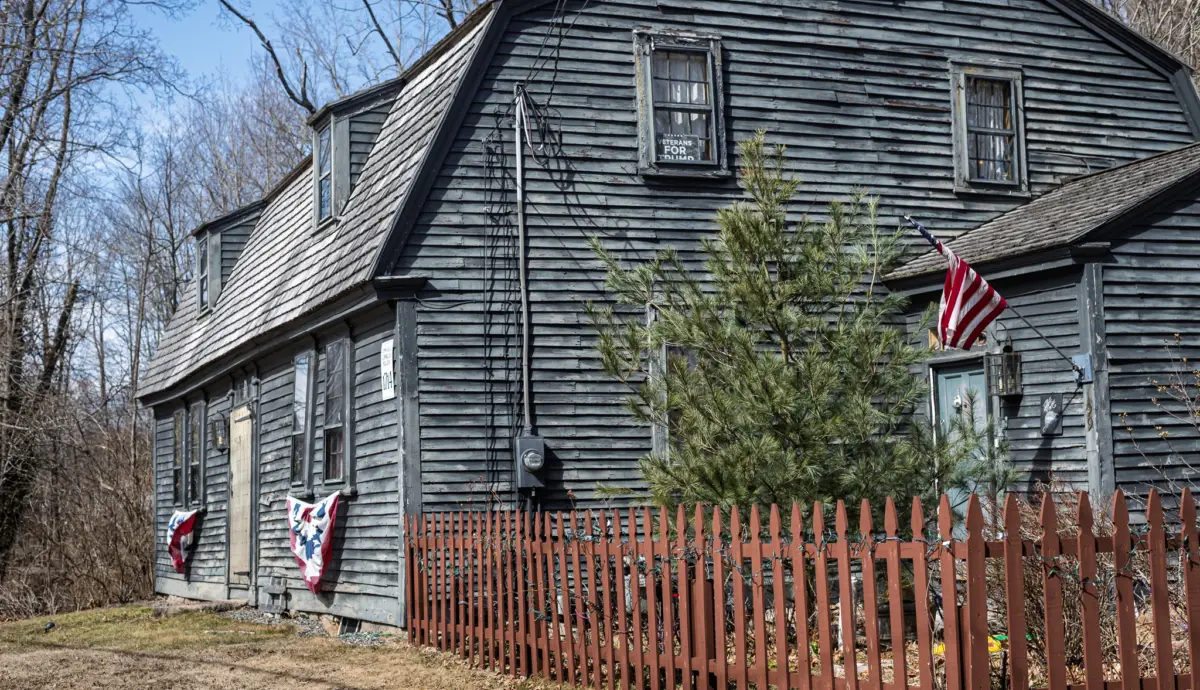 It used to be that flying the flag did not have to be an overt political statement, but those days seem to be behind us. Now I see the flag increasingly serving as a symbol of division and segregation.

This grand old colonial style home marked with the sign indicating it dates back to pre-Revolutionary War 1714, now displays, on its front side, politically charged banners referencing presidential campaigns and, just to make the message clear, a “Veterans for Trump” sign in the window, along with another flag by the entrance.
