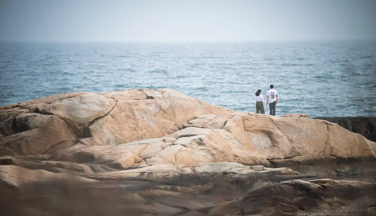 I captured these images of a couple enjoying each other's company on the rocky coast, all while Bruce Cockburn’s song “Lovers in a Dangerous Time” played in my head: 

“When you’re lovers in a dangerous time / Sometimes you’re made to feel as if your love’s a crime / But nothing worth having comes without some kind of fight / Got to kick at the darkness till it bleeds daylight”